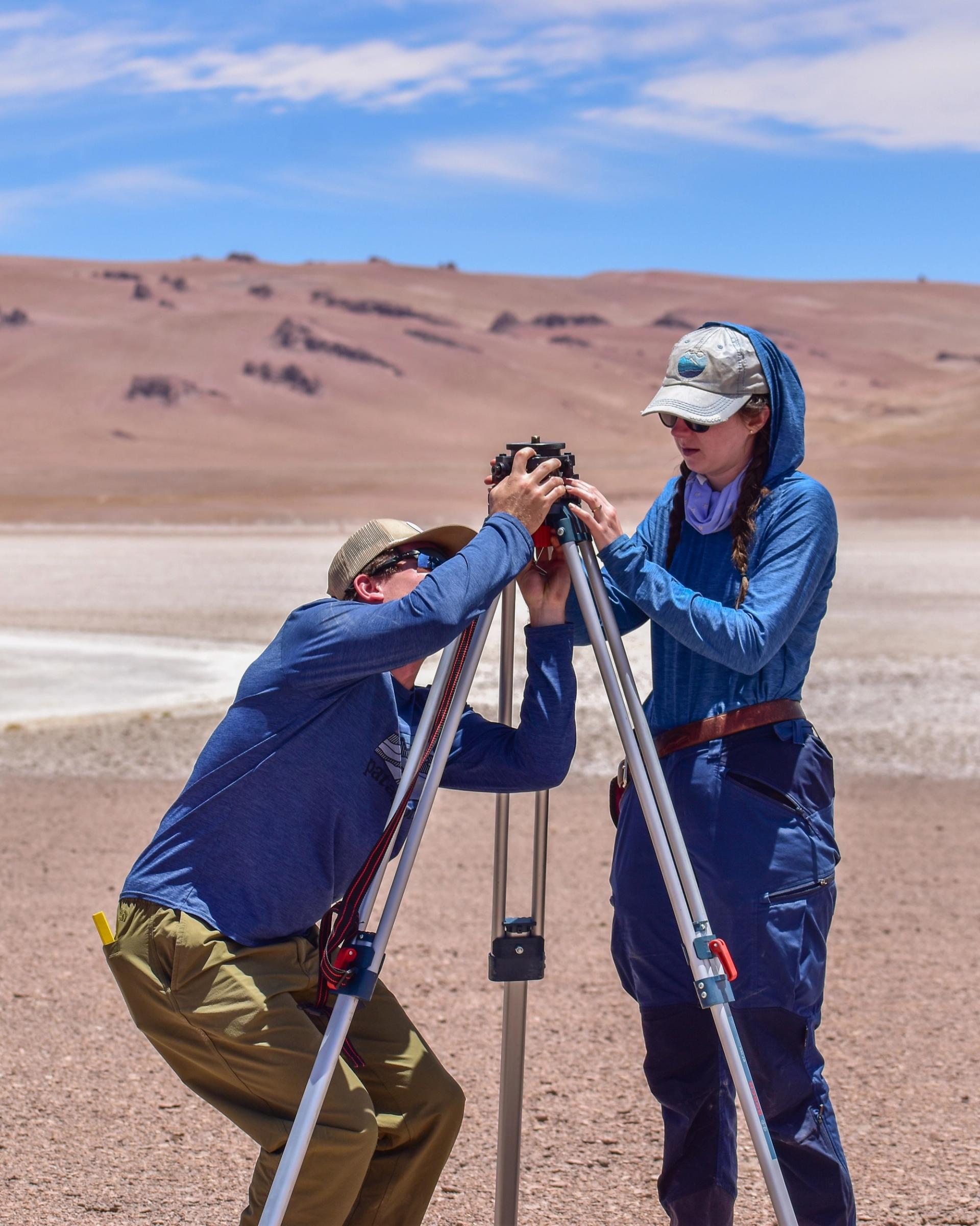 Photo of GSA Graduate Student Research Grant Recipients conducting applied geologic mapping and field methods in red desert