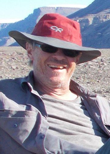Jean H. Bédard in a red and gray hat and sunglasses.