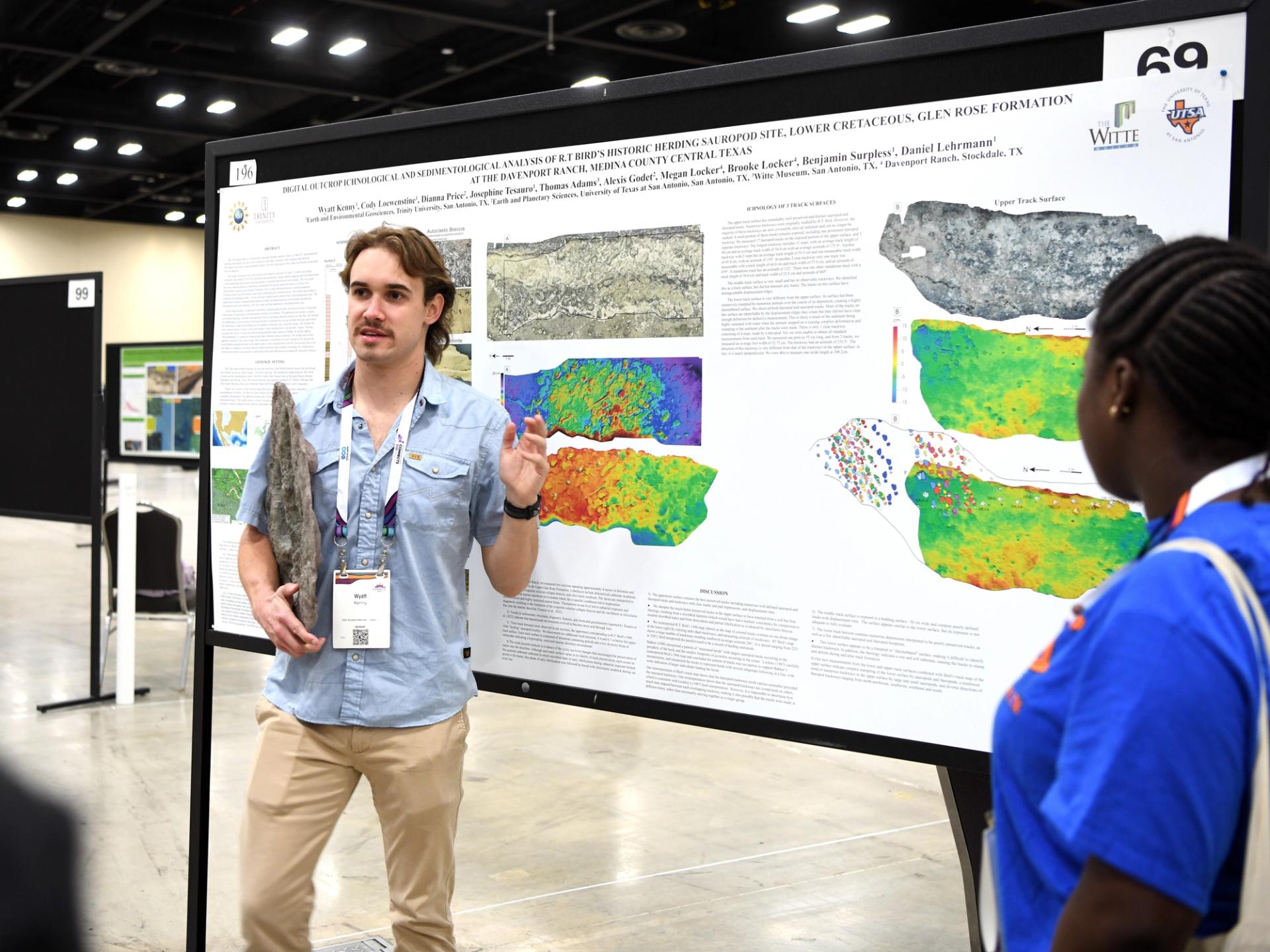 Photo of student presenting research poster at a GSA Connects meeting