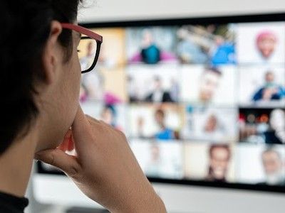 Man watching webinars.