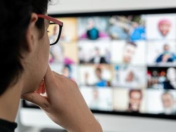 Man watching webinars.