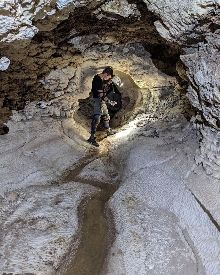 Photo of GSA Graduate Student Research Grant Recipient conducting research in a cave