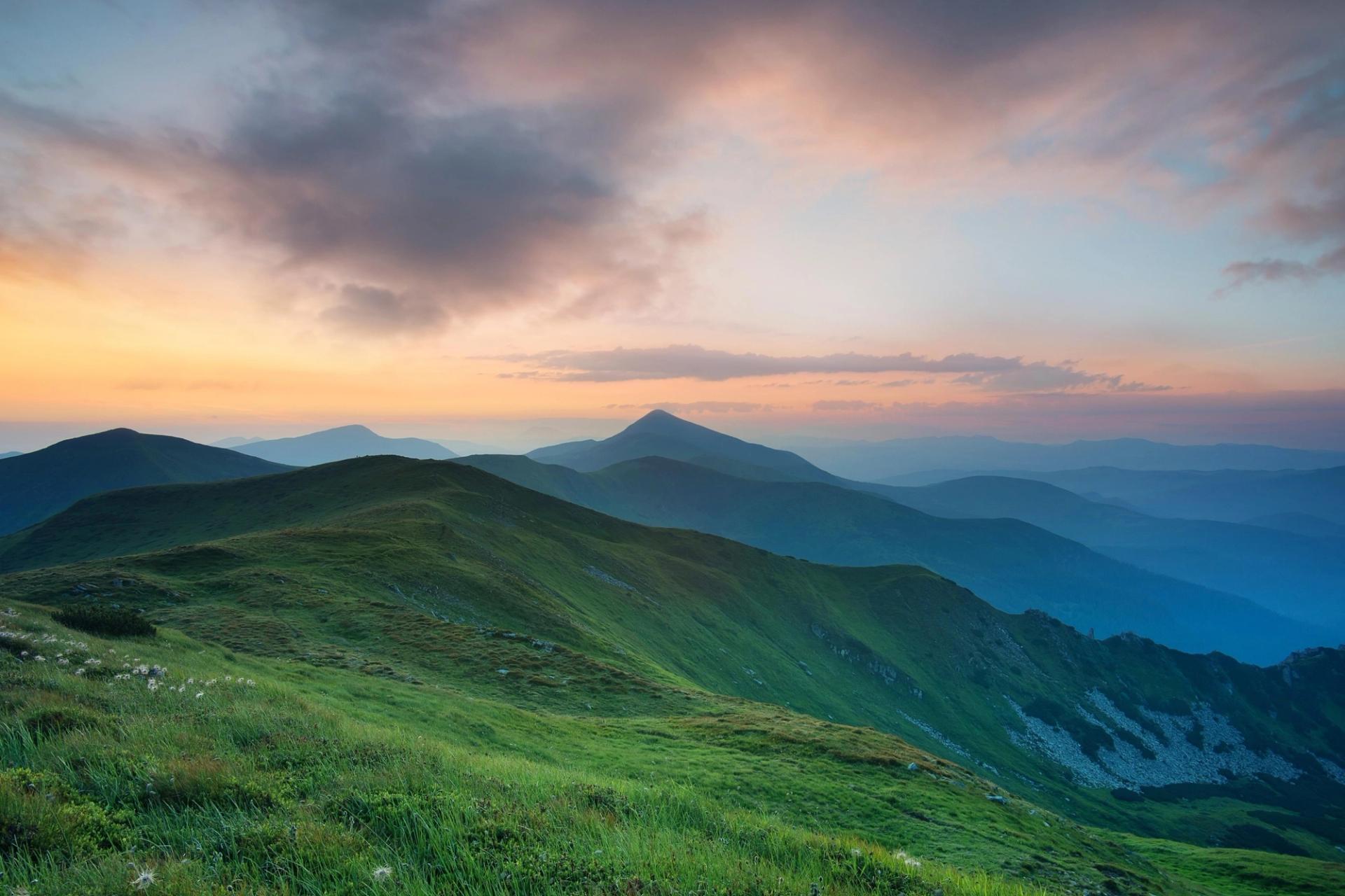 Beautiful tree covered Blue Ridge Appalachian Mountains at sunset rainbow sky