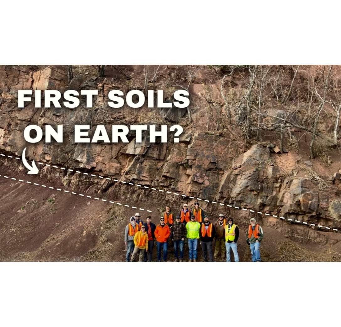 GSA Field Trip to the Devonian YouTube Thumbnail Image showing field trip participants posing in front of large outcrop of some of the oldest soils on Earth