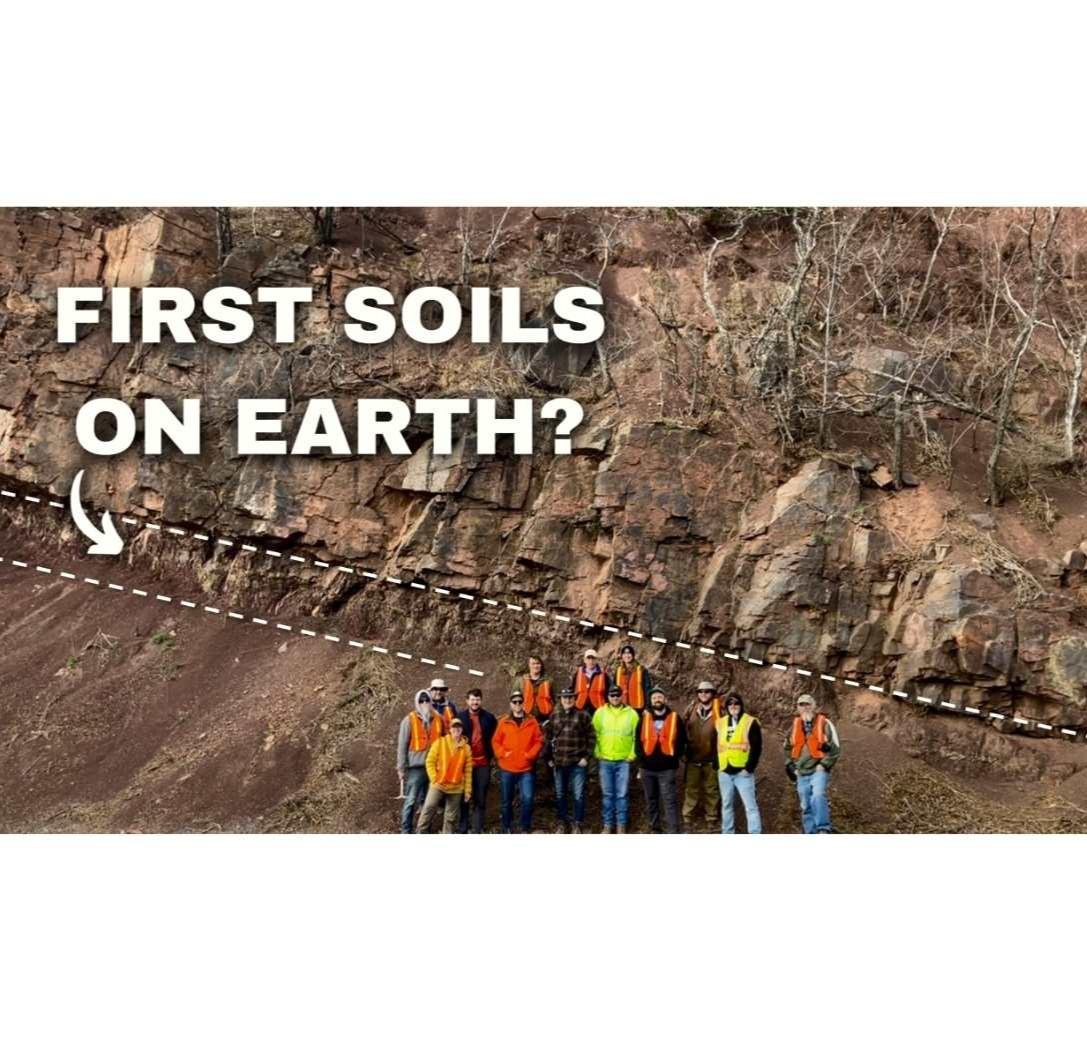 GSA Field Trip to the Devonian YouTube Thumbnail Image showing field trip participants posing in front of large outcrop of some of the oldest soils on Earth