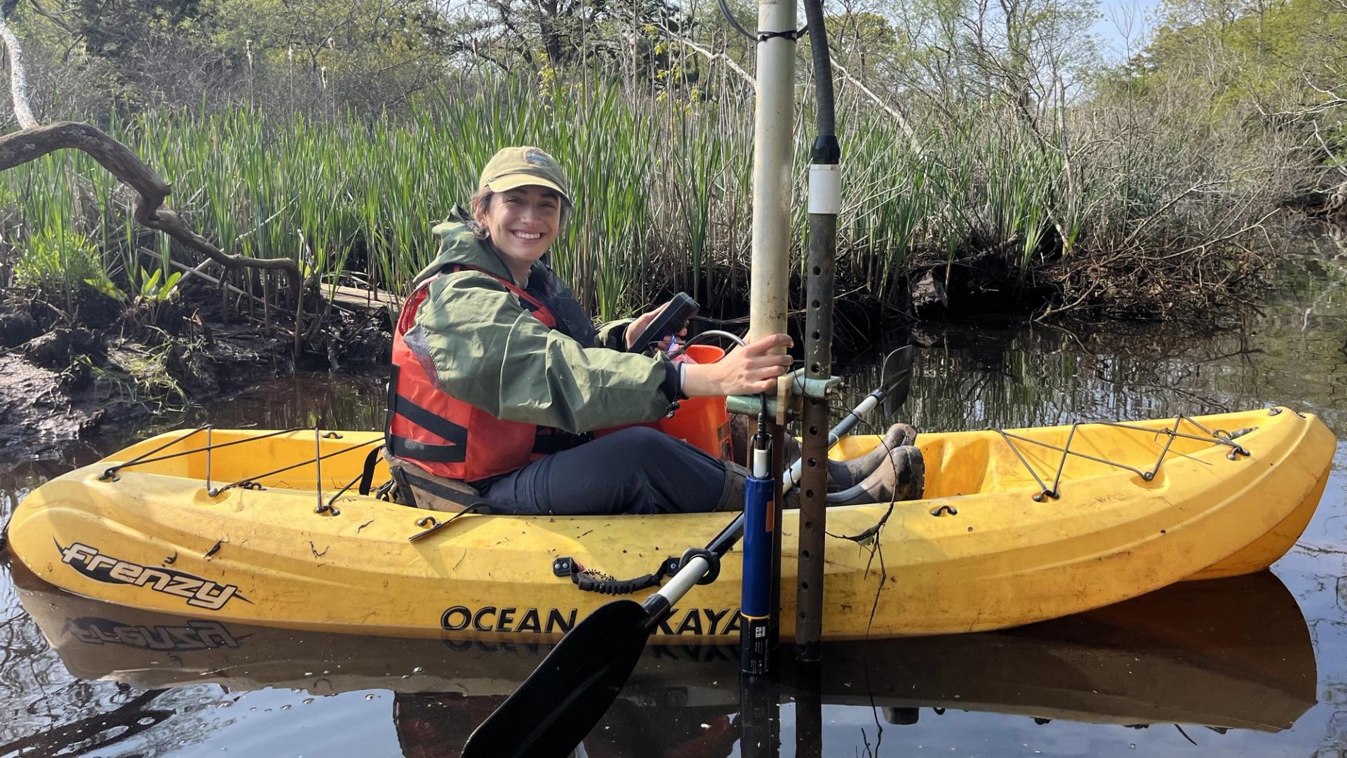 Scientists in the Parks participant conducting fieldwork by boat