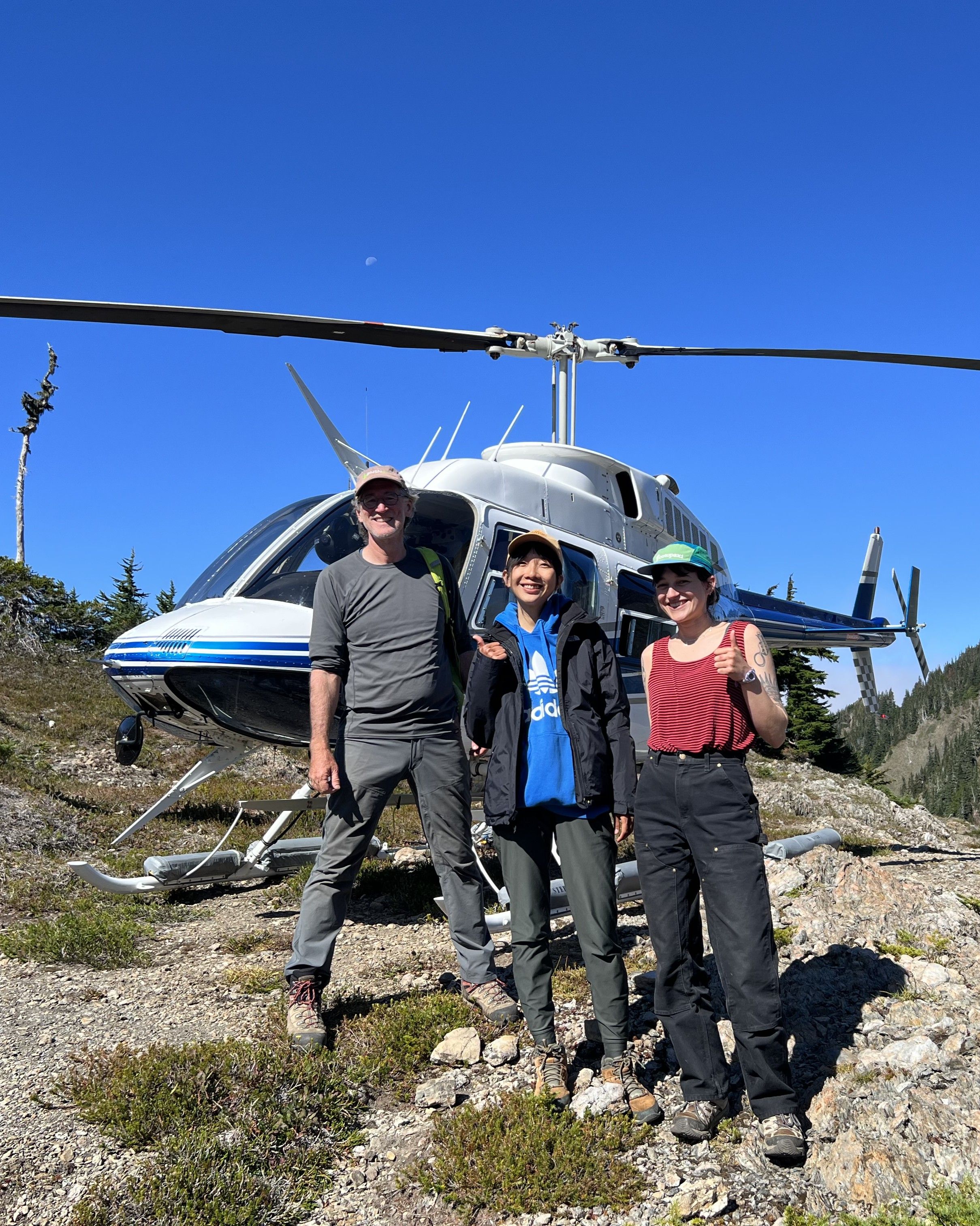 Photo of GSA Graduate Student Research Grant Recipients conducting geoscience research in the field by helicopter
