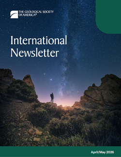 Thumbnail-sized image of April/May 2026 GSA International Newsletter of a person with a large backpack hiking in the desert and gazing up at the expansive night sky.