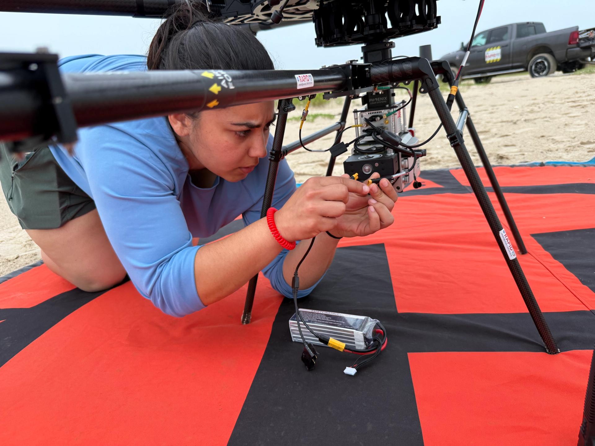 Hot swapping batteries for the Phoenix MiniRanger LiDAR System. This project included collecting drone-based LiDAR of the Eastern Matagorda Peninsula, TX for the second chapter of my dissertation. Field work was supported by NSF grant (#2130997) Manica received as a NHERI Grad Scholar. (May 2026)