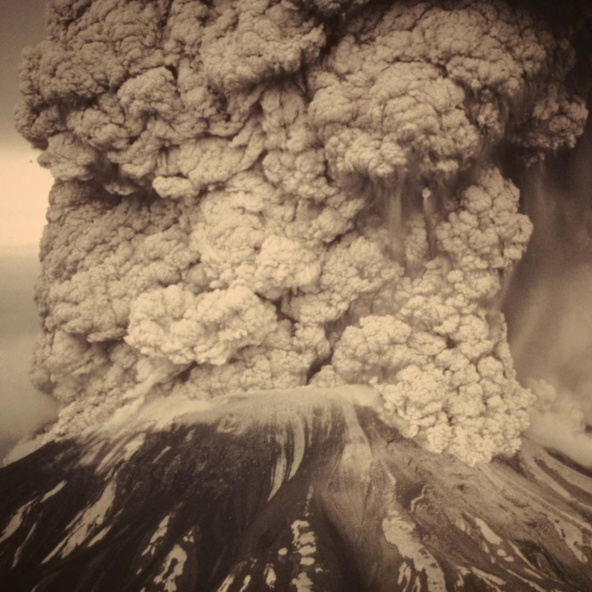 Photo of large explosive volcanic eruption with huge ash plume