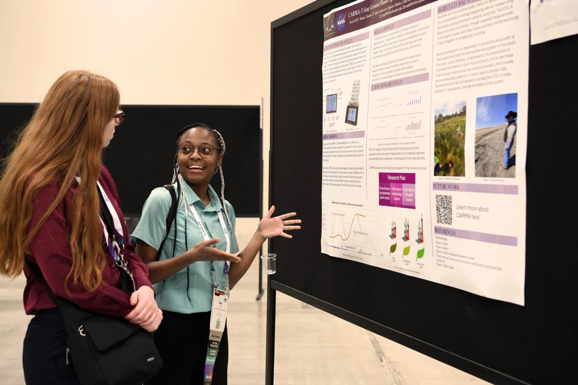 Geology student presenting poster at GSA meeting
