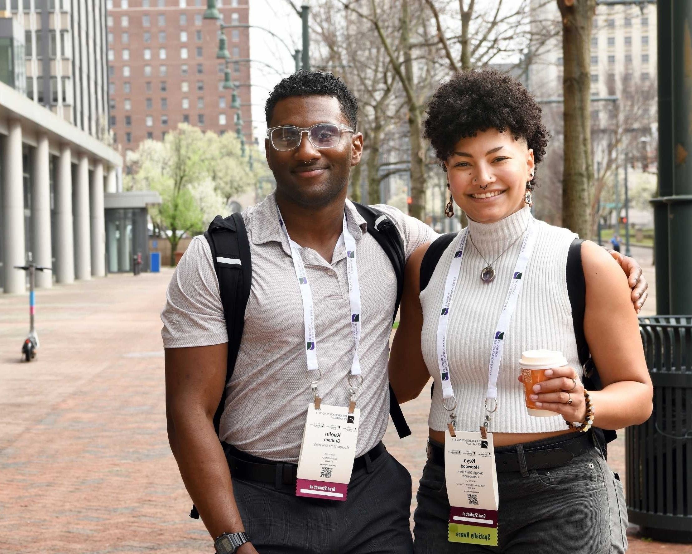GSA meeting attendees smiling for photo outside of conference center
