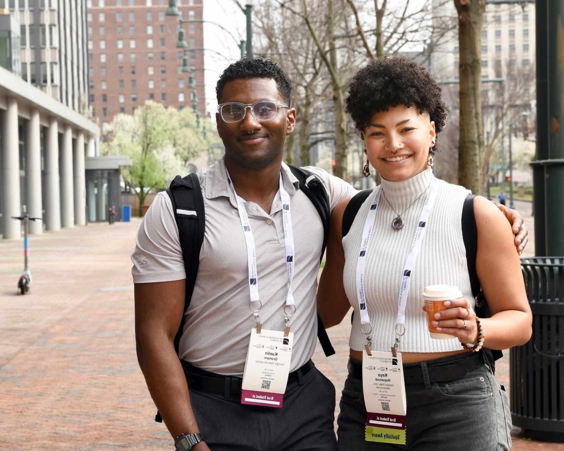 GSA meeting attendees smiling for photo outside of conference center