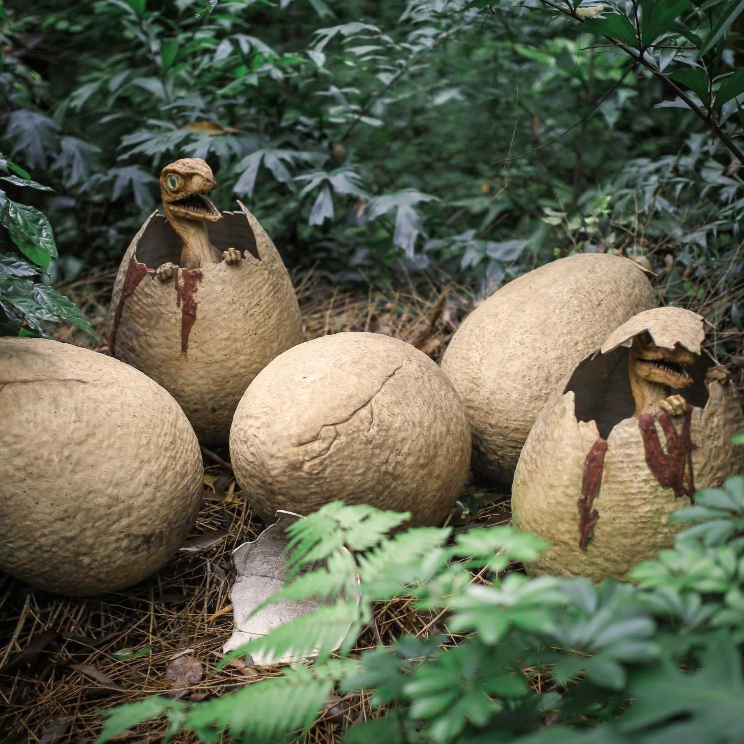 Ancient dinosaurs hatching from eggs