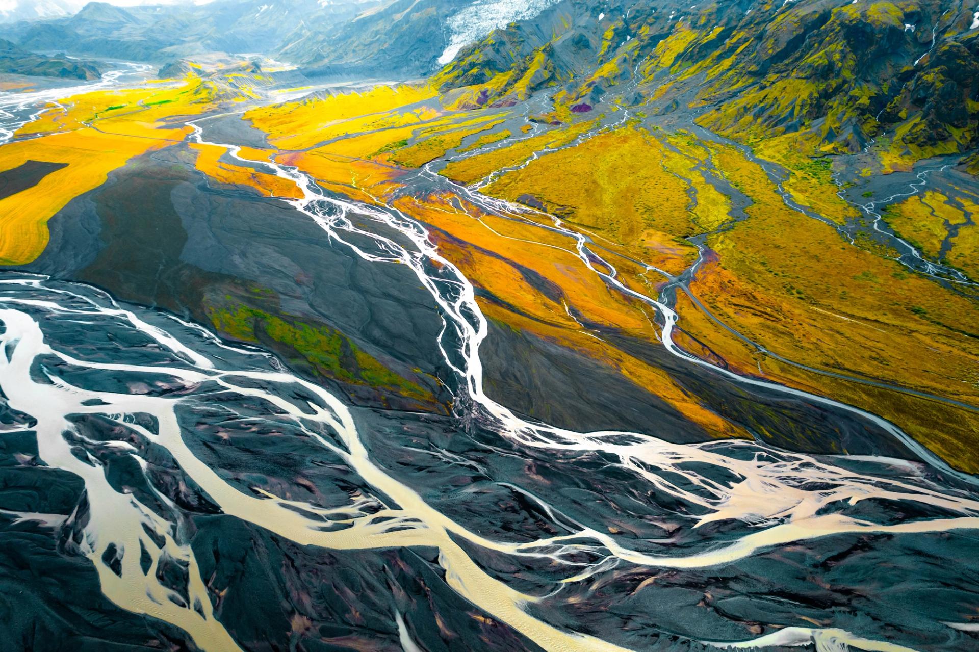 Abstract picture taken with drone flying above a system of multiple glacier rivers flowing and creating beautiful pattern system. Iceland.