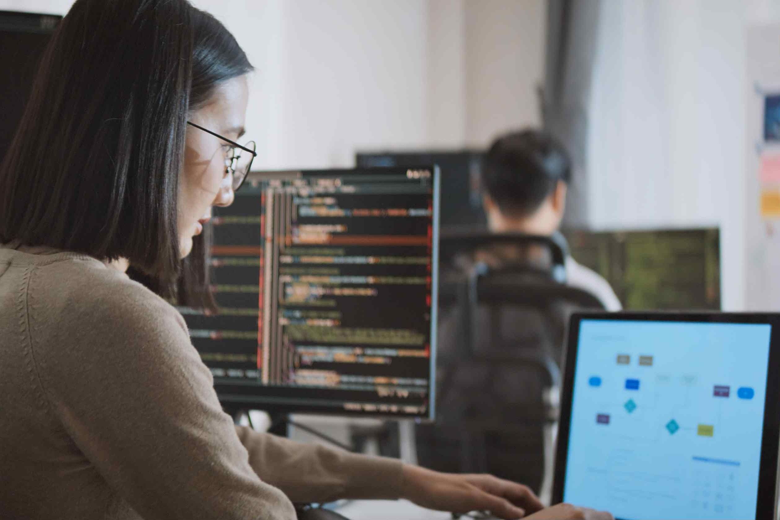Image of scientist coding and modeling on computer