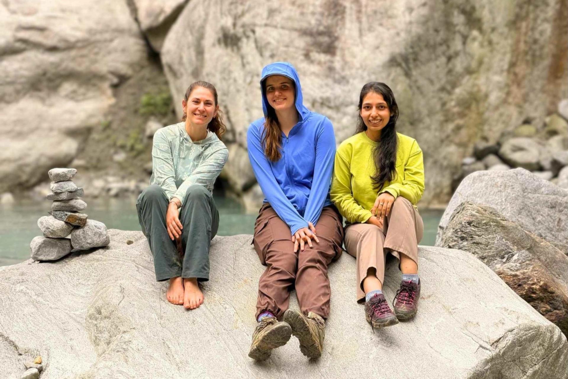 Three young geologists sitting on rock at Nepal Penrose Field Trip
