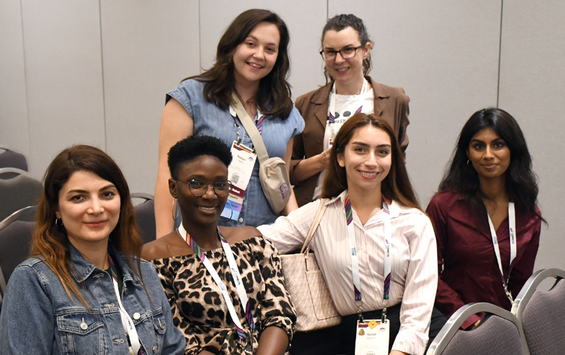 Multiple women at a GSA meeting smiling and posting for a picture.
