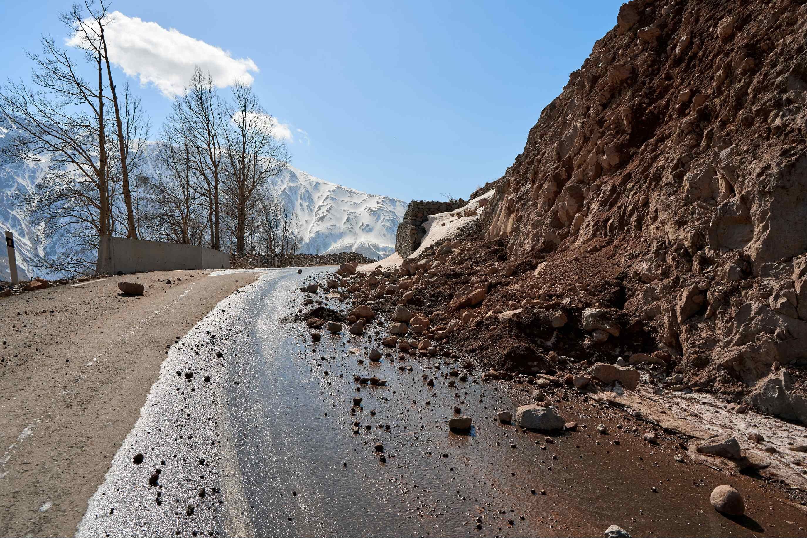 Image of a landslide partially covering a road