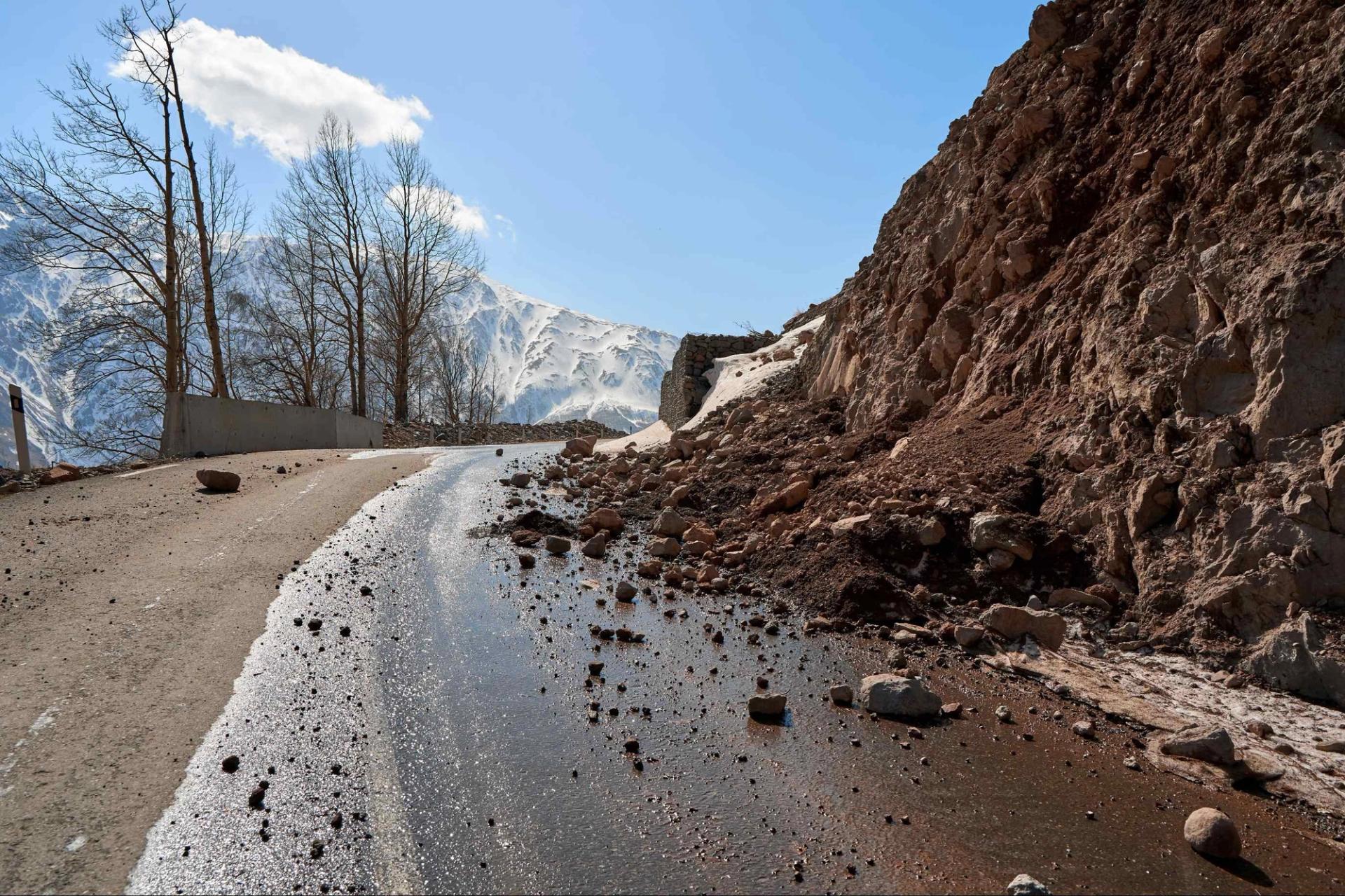 Image of a landslide partially covering a road