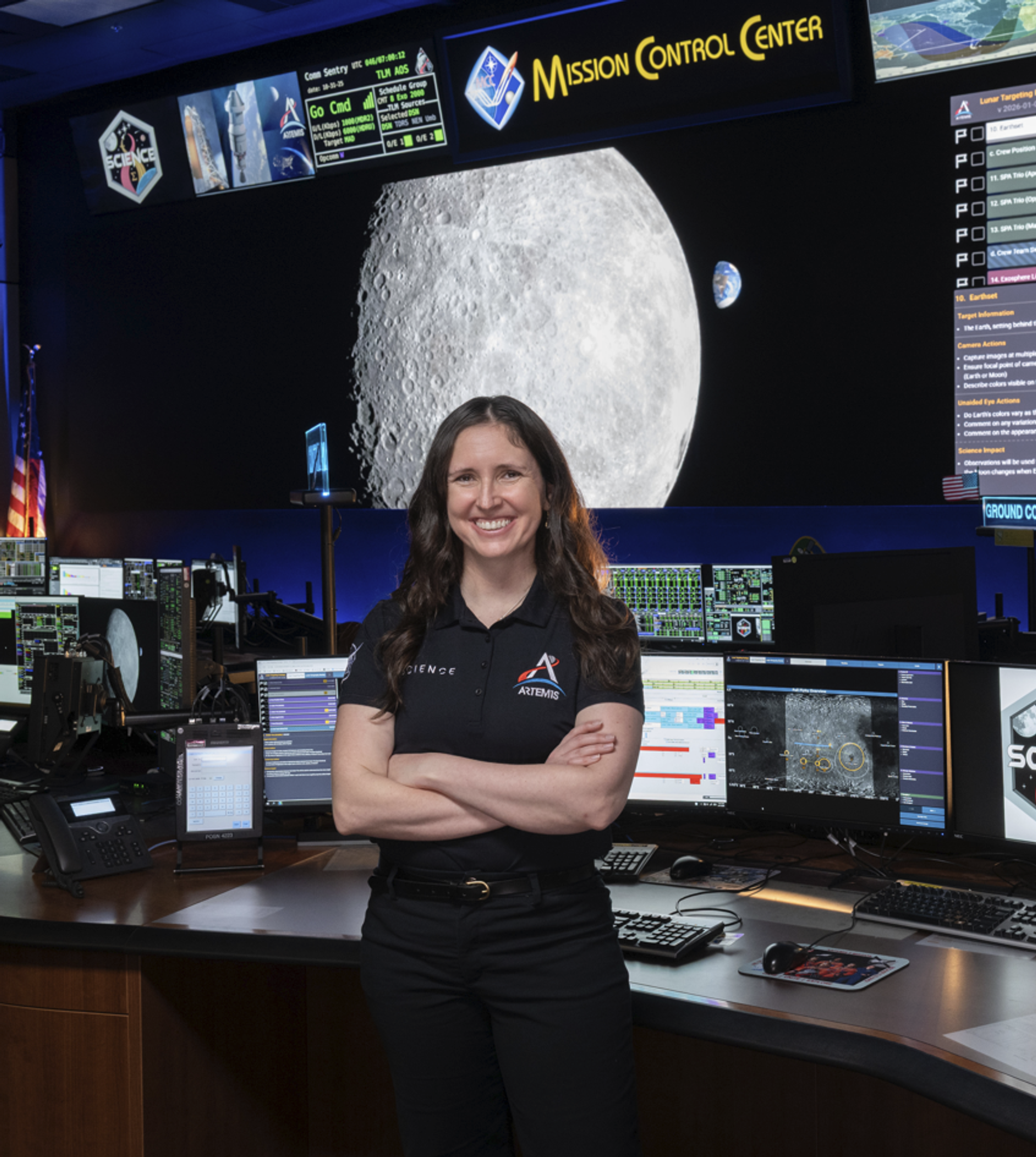 Kelsey Young, NASA Artemis Scientist, in front of Mission Control Center