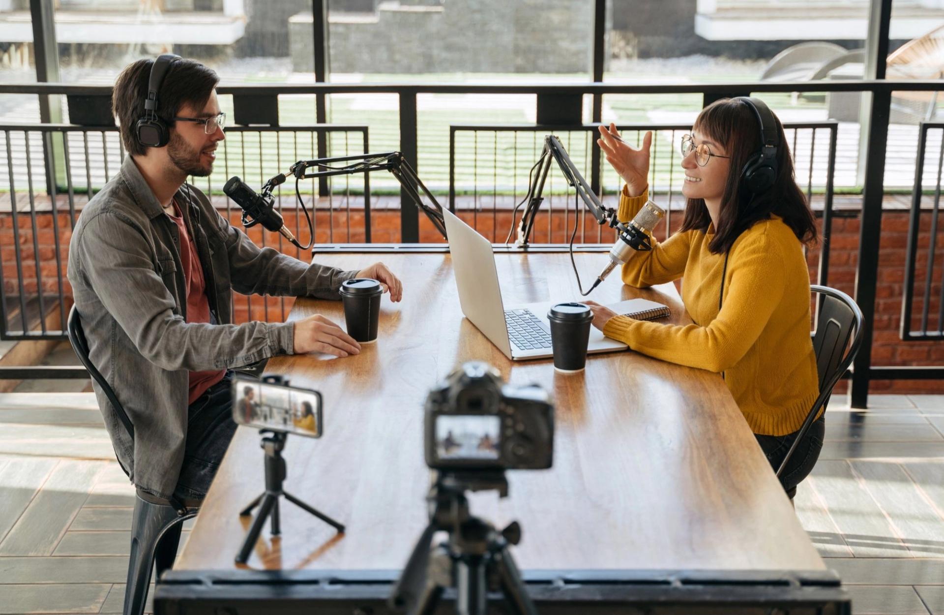 Stock photo of two people recording a podcast
