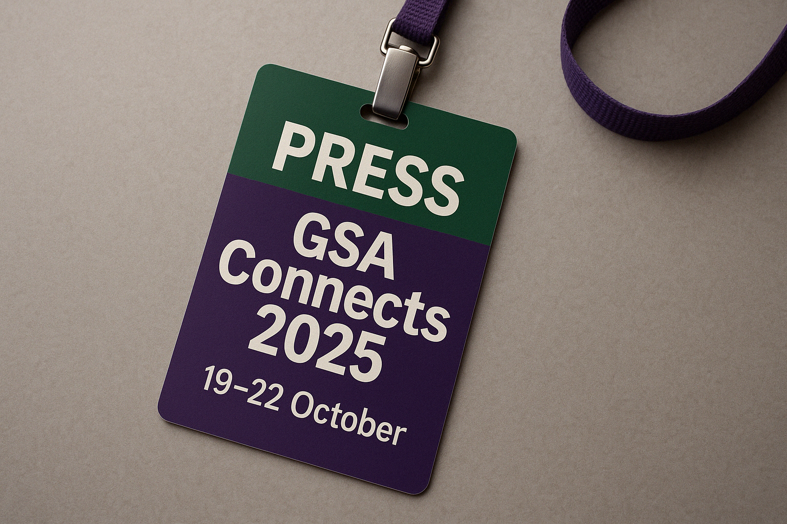 A purple and green press badge.