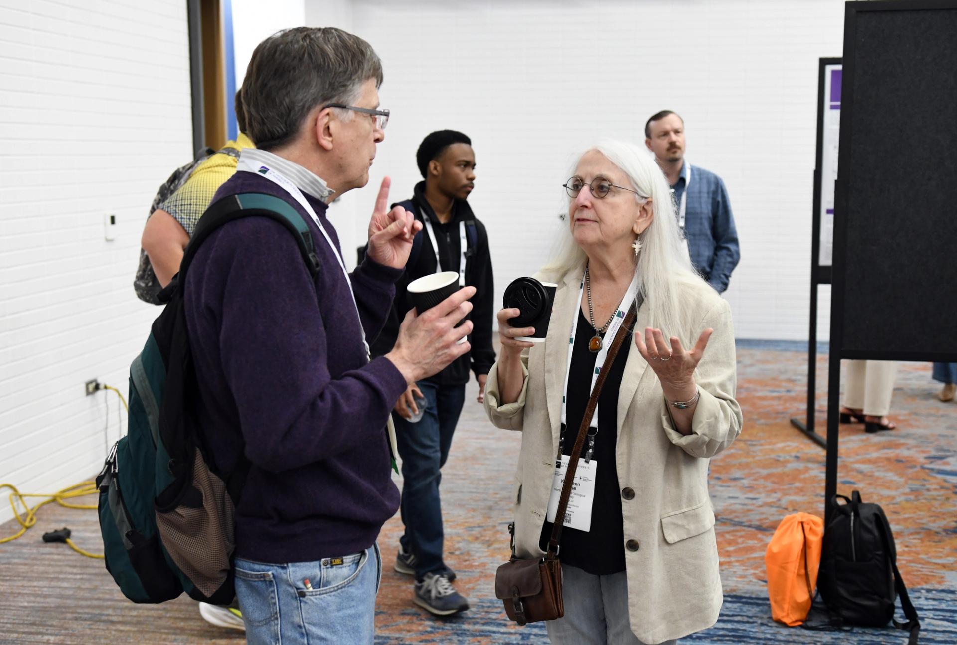 Two people at GSA Connects chatting.