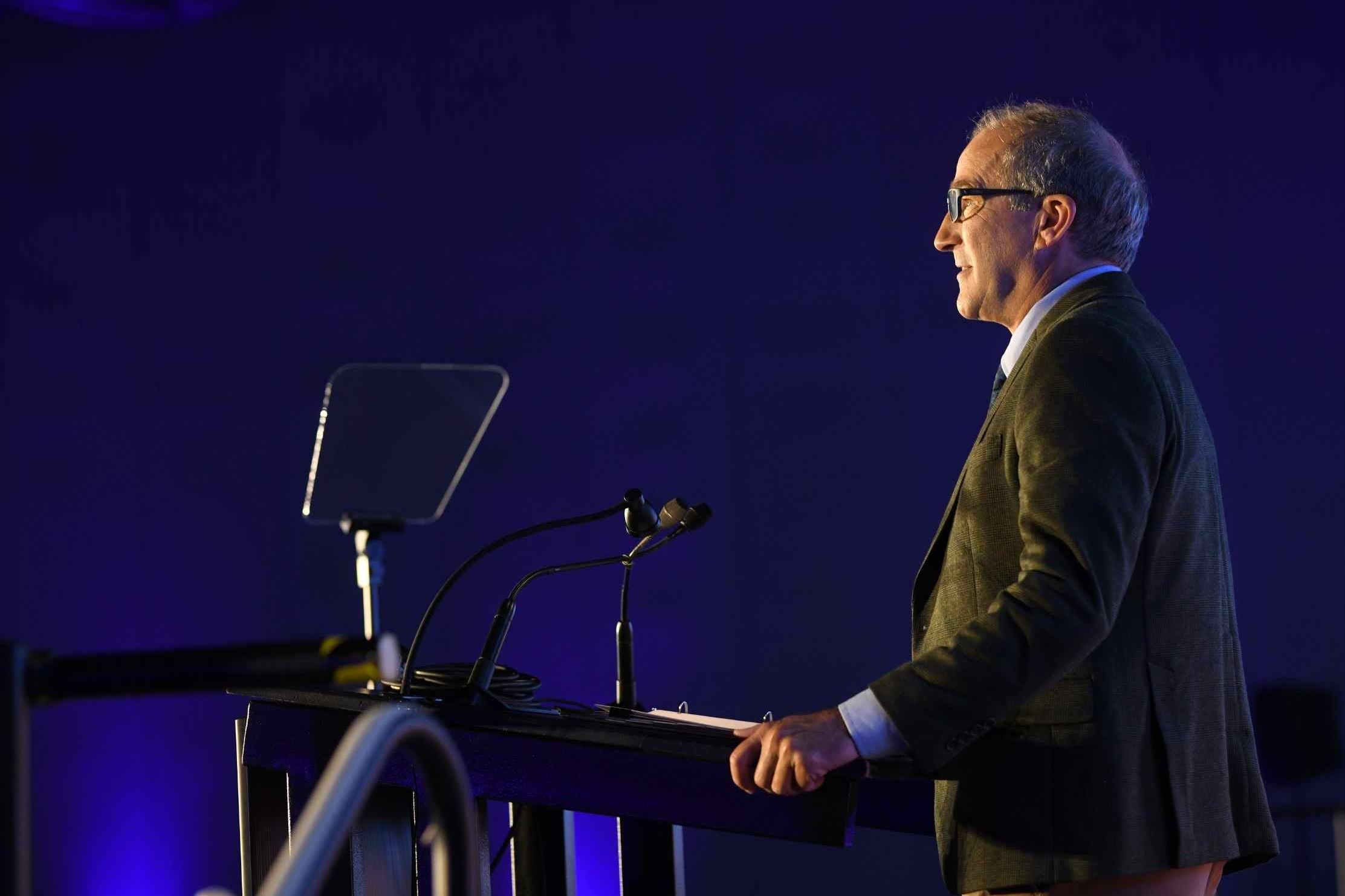 GSA president Glenn Thackray presenting on stage