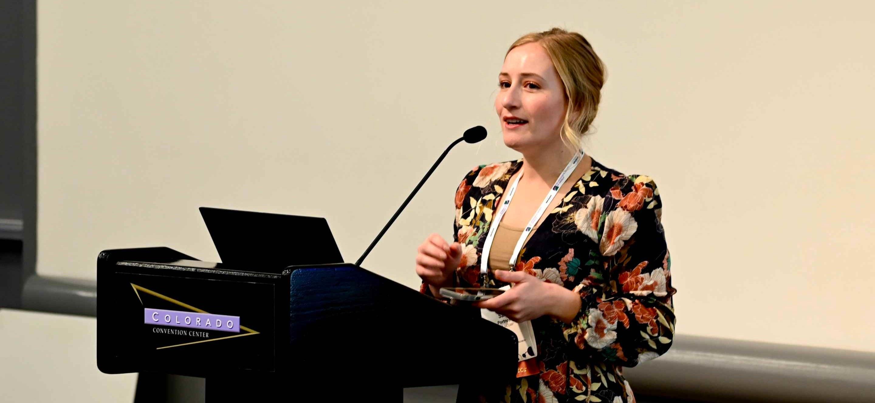 Landscape photo of female oral presenter at GSA Connects