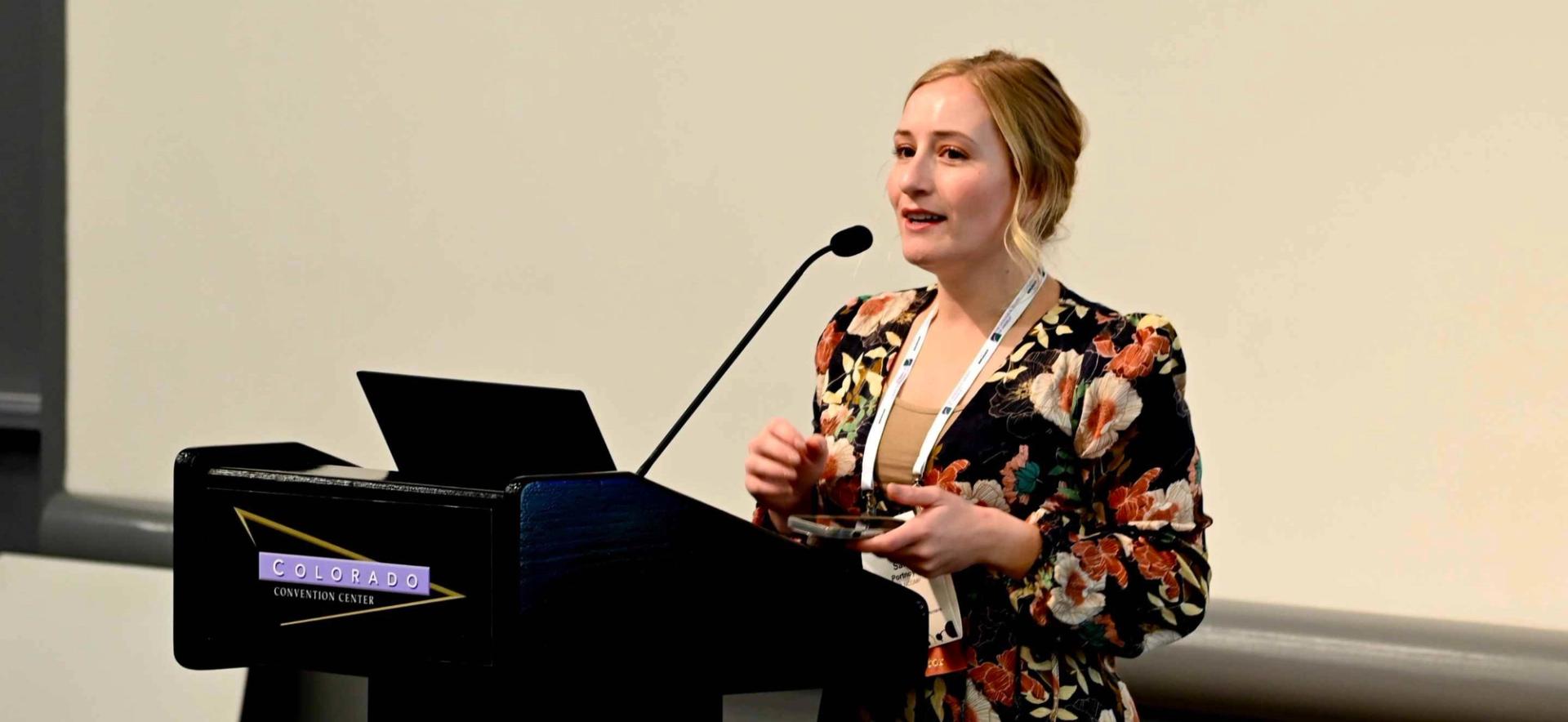 Landscape photo of female oral presenter at GSA Connects
