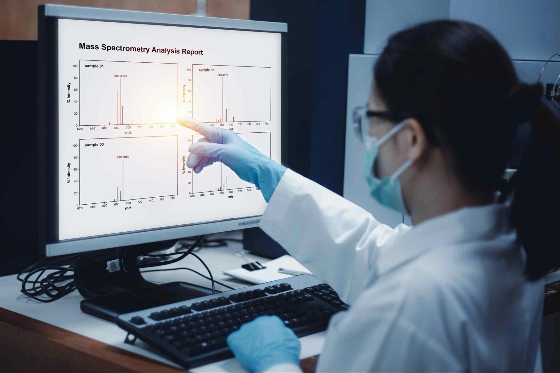Image of scientist analyzing mass spectrometry data