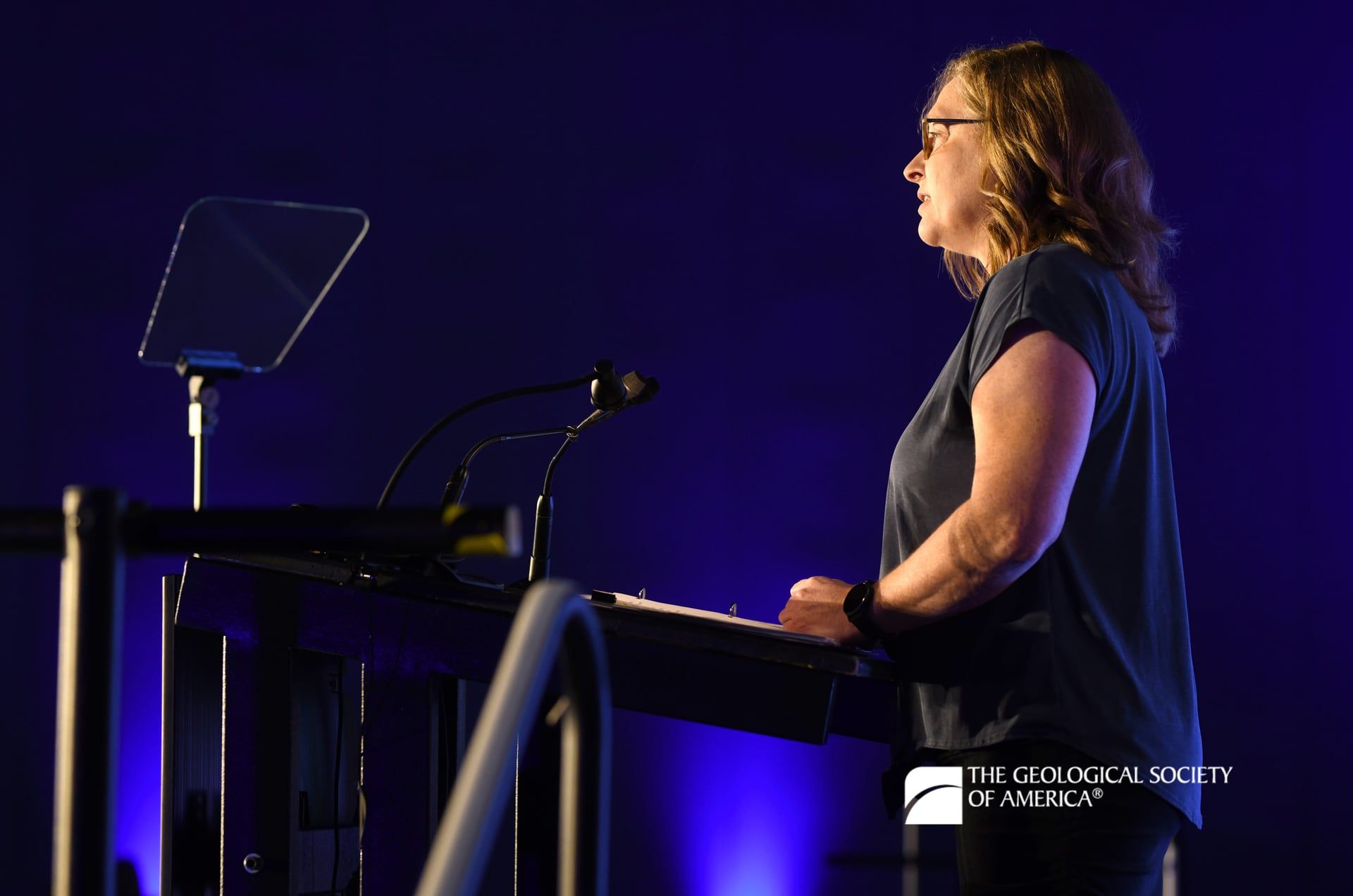 A Connects 2025 presenter faces the audience and looks out as they stand at the podium.