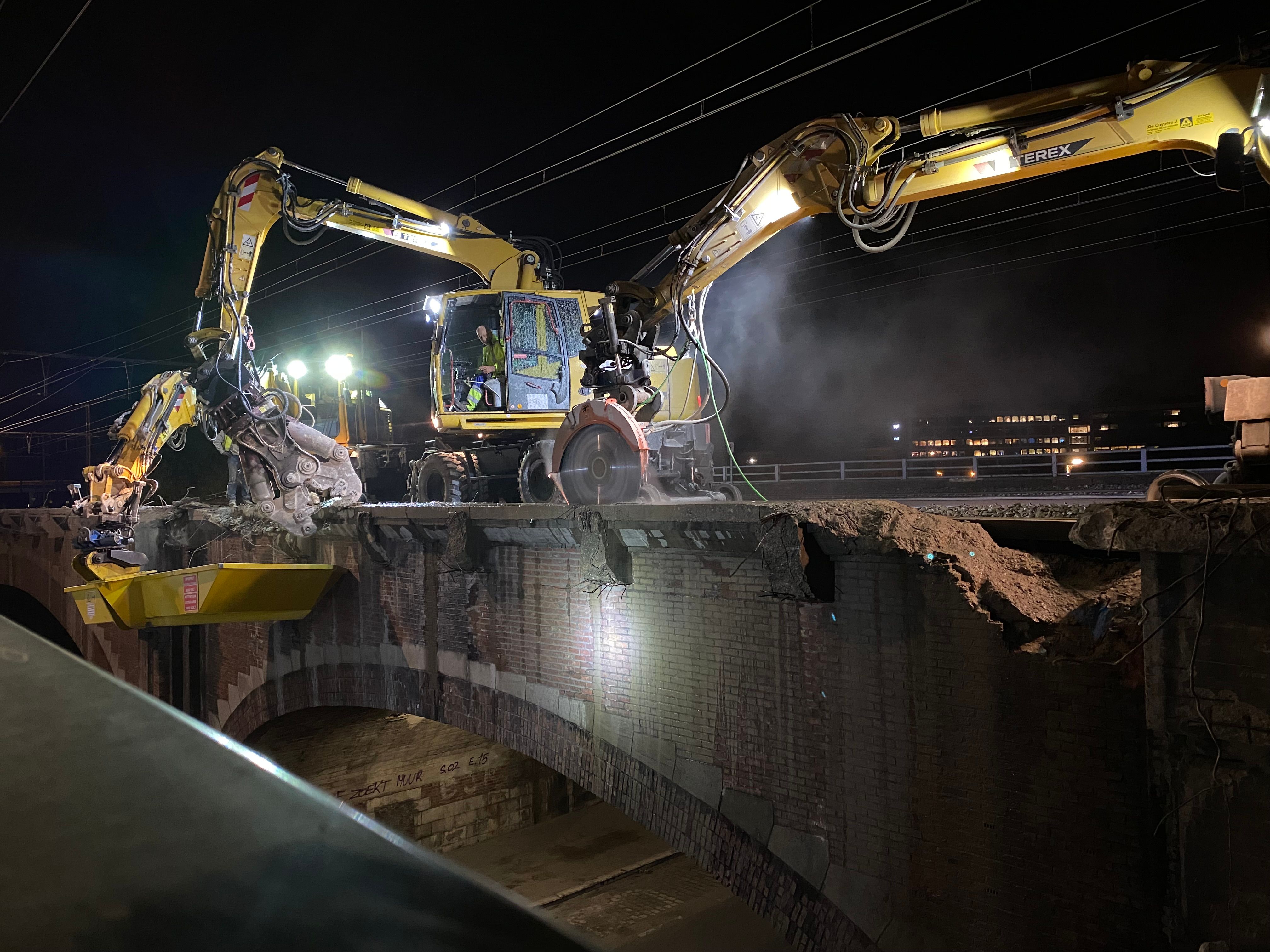 An excavator-mounted Echidna rocksaw being used to cut a bridge