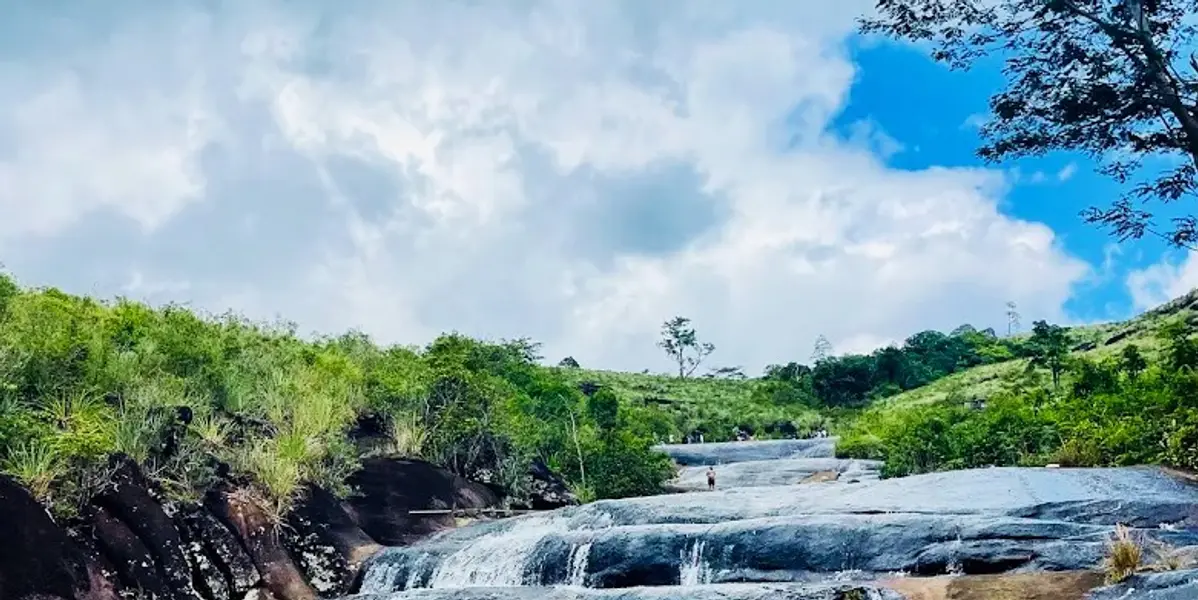 Water flowing over the smooth rock at Patna Sliding Rock near Deniyaya, Sri Lanka