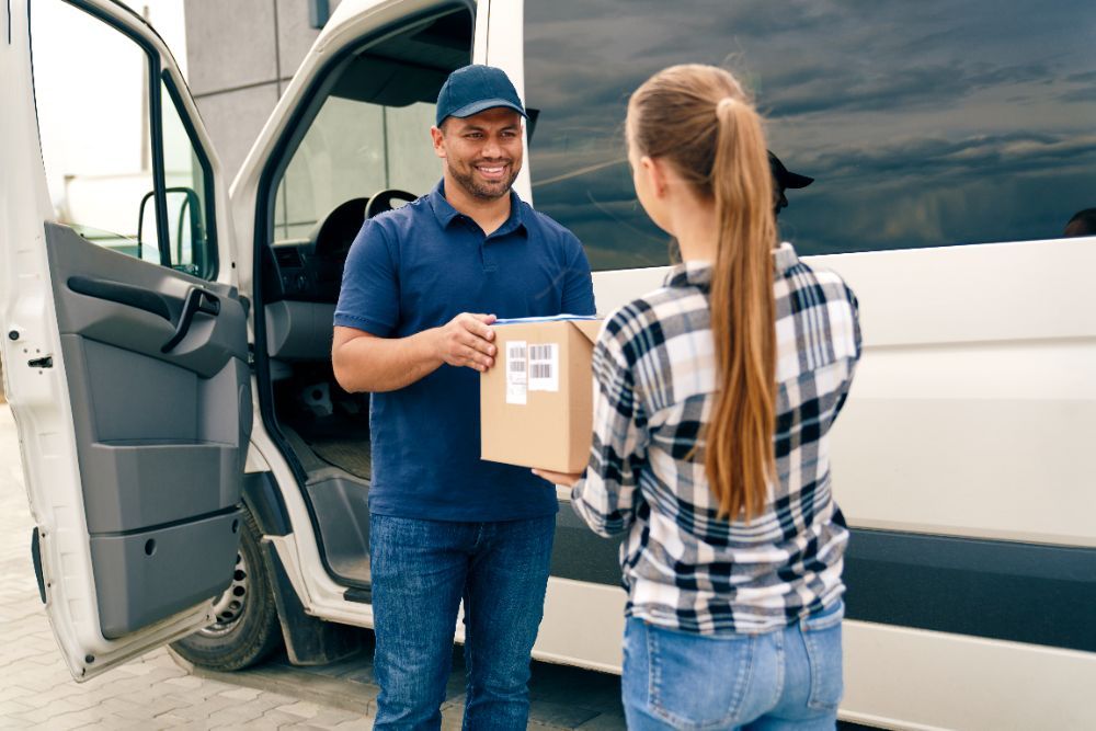 Courier handing a parcel to a customer
