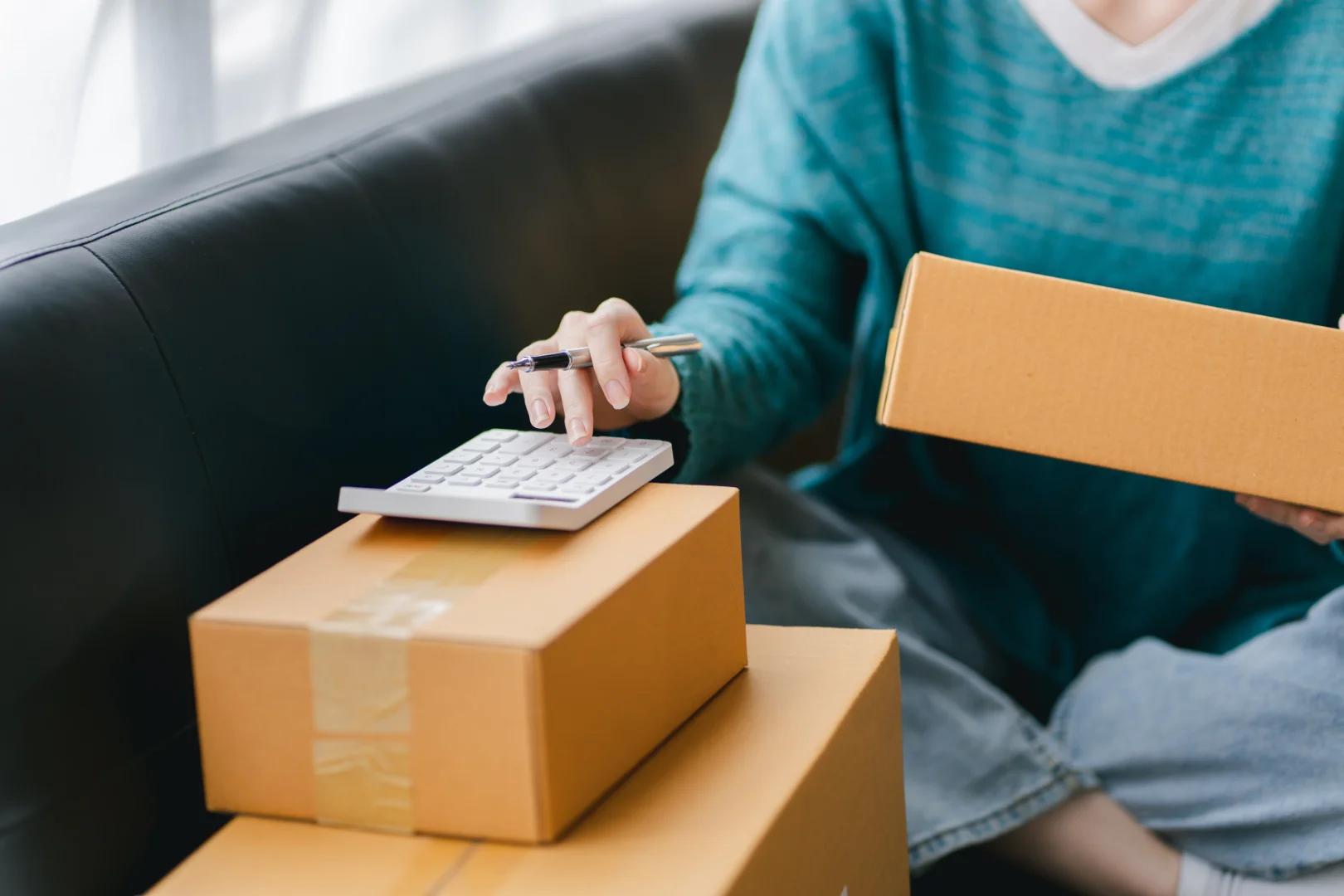 A sender handing a parcel over at the door