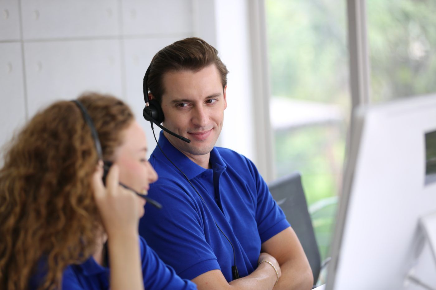 Support advisers on headsets in the UK office