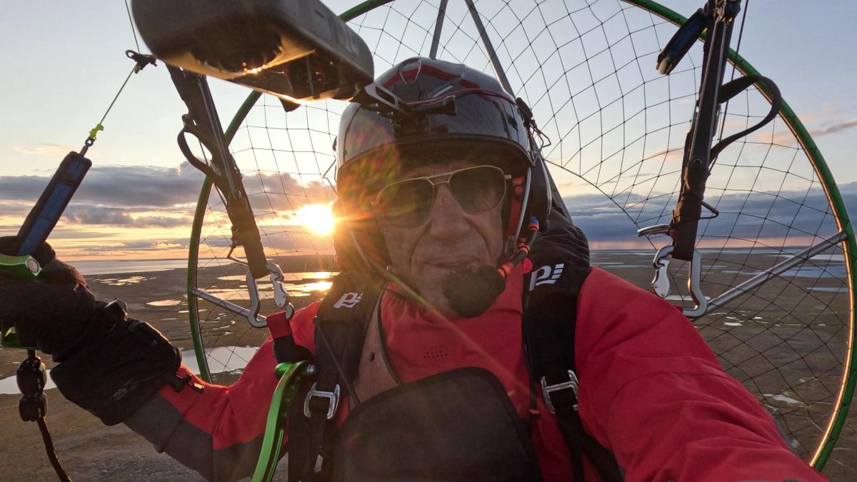 Sylvestre Campe paramotors over the vast lake system on Victoria Island. Credit: Sylvestre Campe, MEDIA.etc