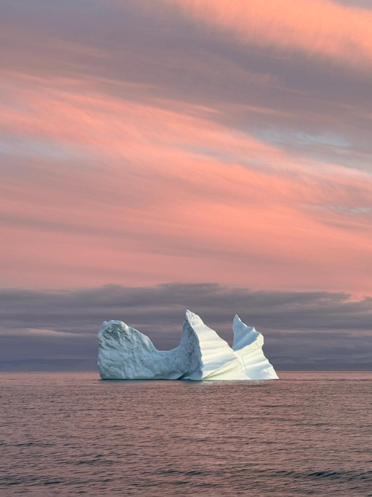 Pink skies over an iceberg in Tasiujaq (formerly Eclipse Sound). Credit: Keith Tuffley