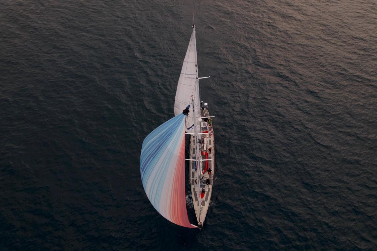 The Abel Tasman sails through the Beaufort Sea with her Climate Stripes Sail. Credit: Ramon Gonçalves, MEDIA.etc