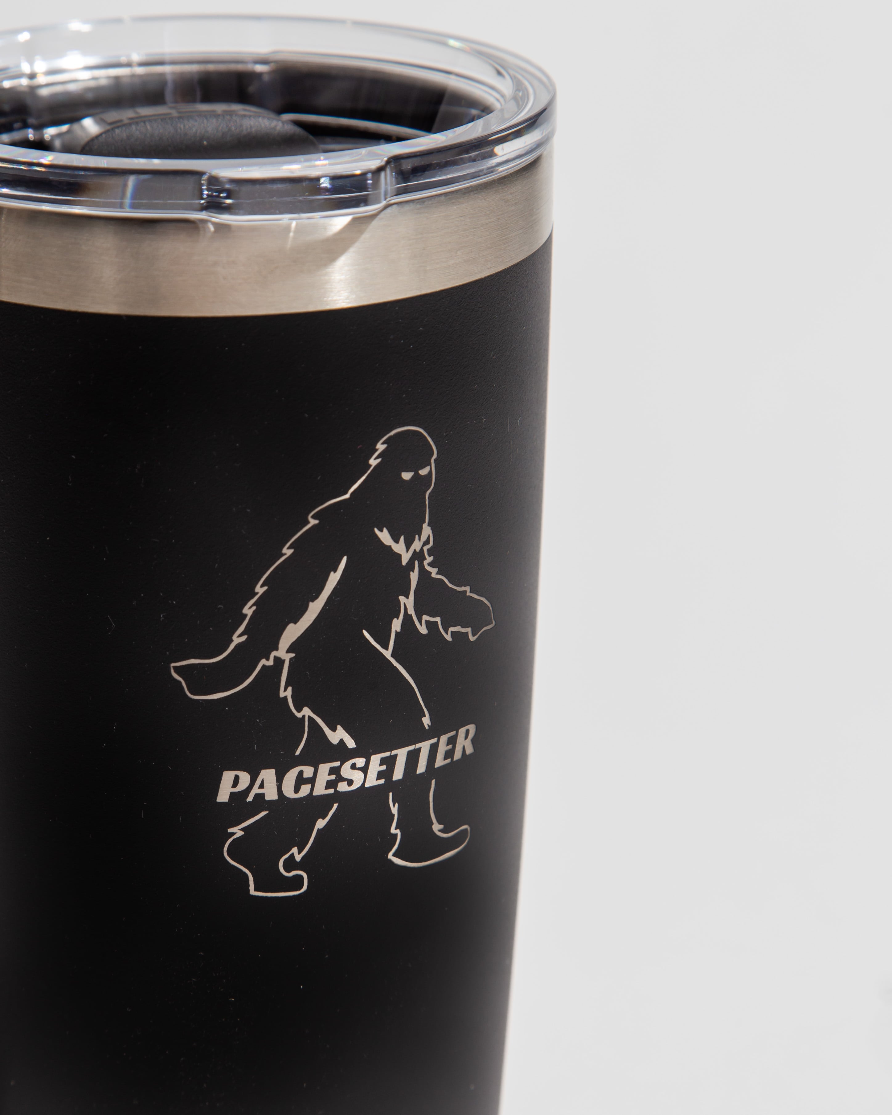 Black tumbler with a Pacesetter logo featuring a silhouette of a walking figure.