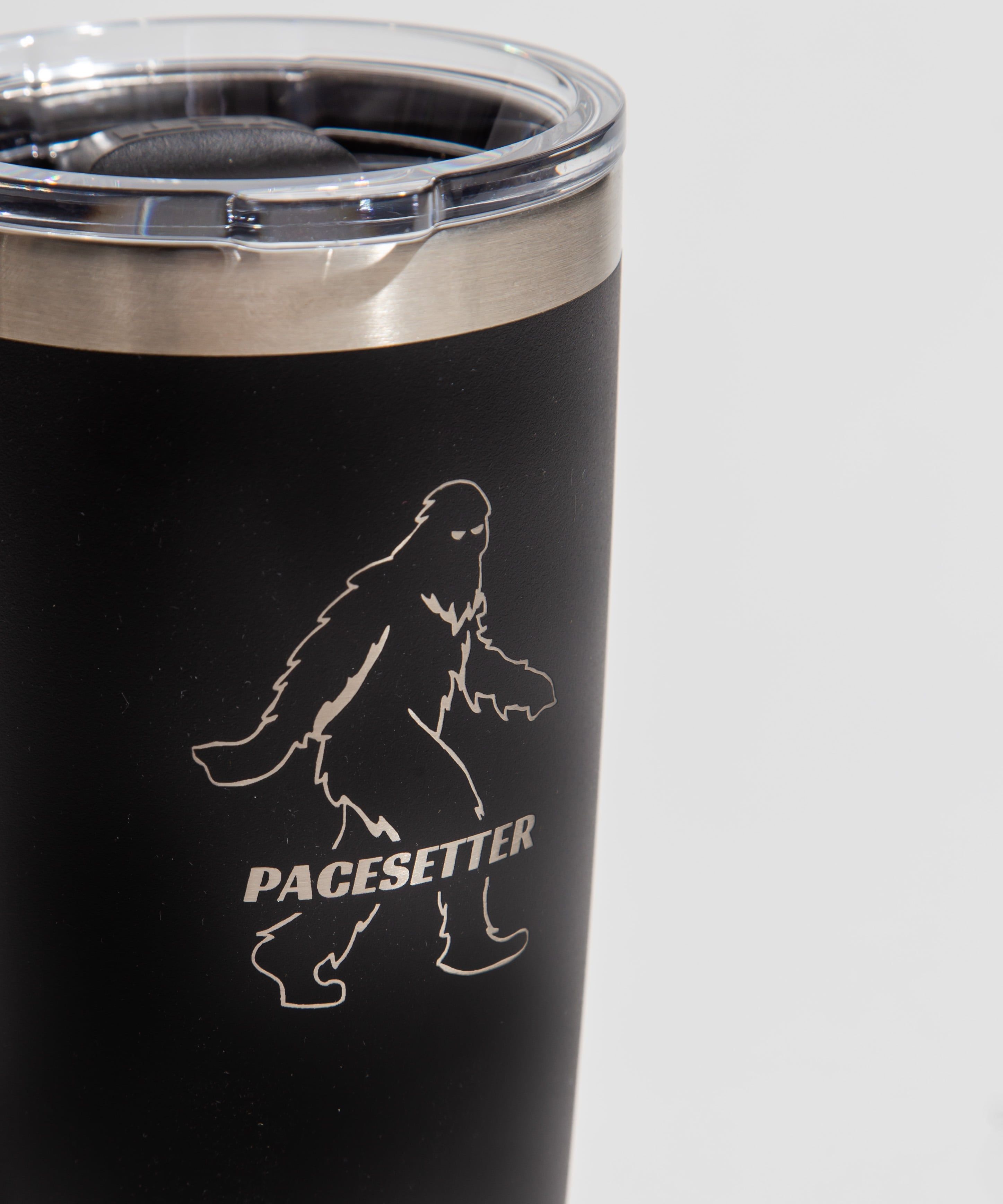 Black tumbler with a Pacesetter logo featuring a silhouette of a walking figure.