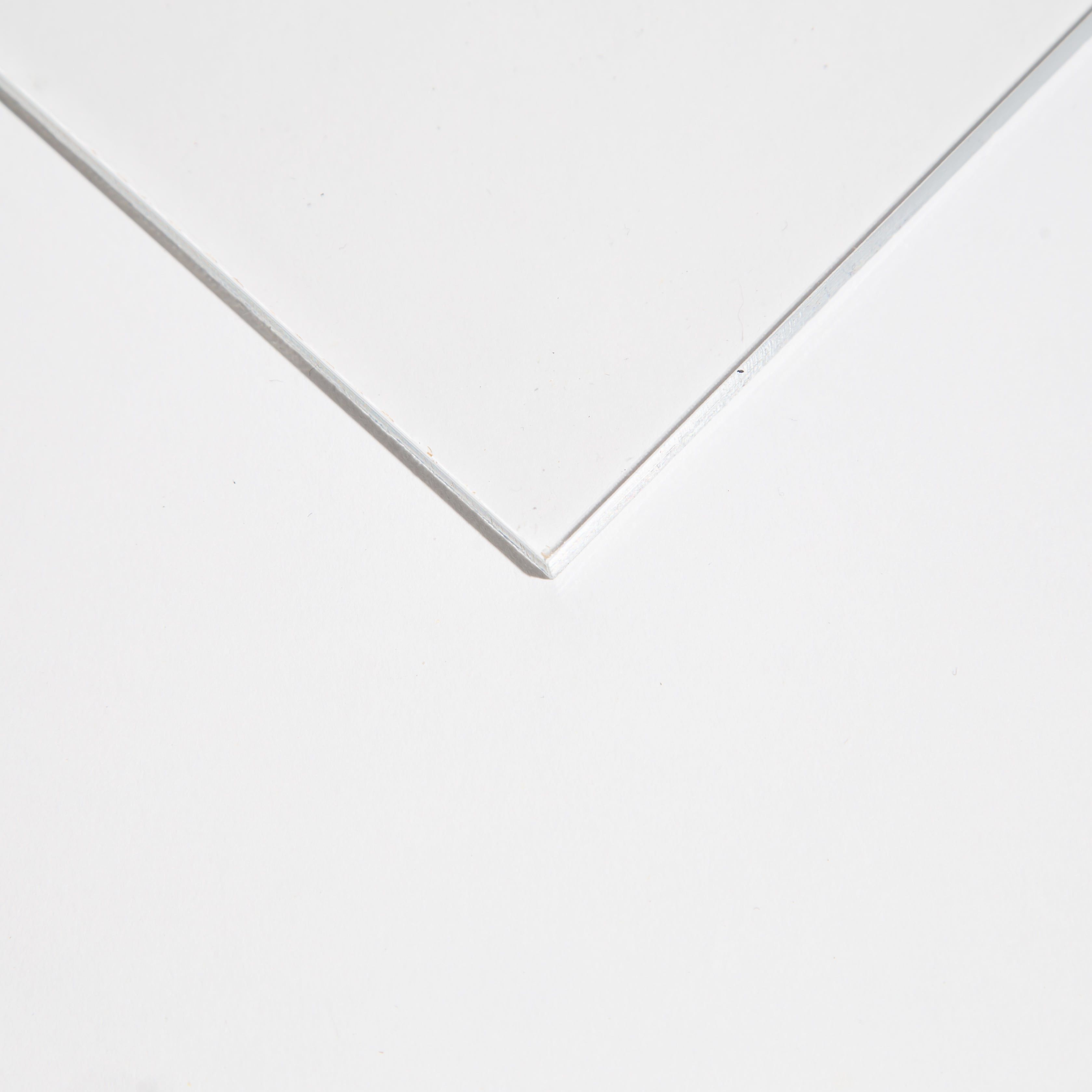 Close-up of a glass corner on a flat surface.