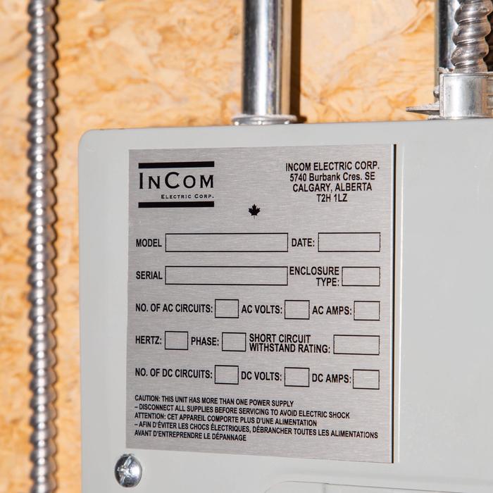 InCom Electric panel label with safety warnings