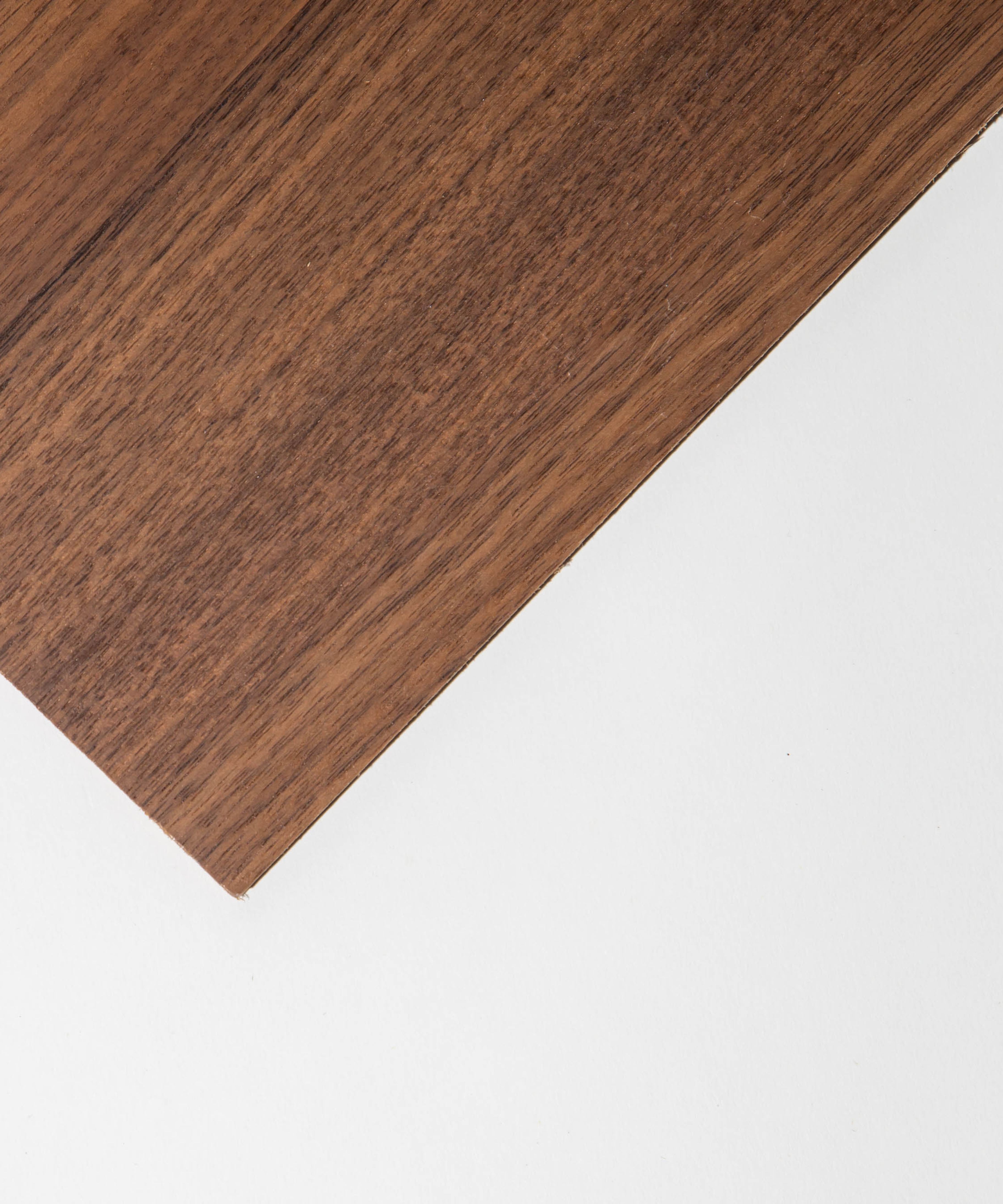 Diagonal wooden panel on a white background, showcasing natural grain and texture.