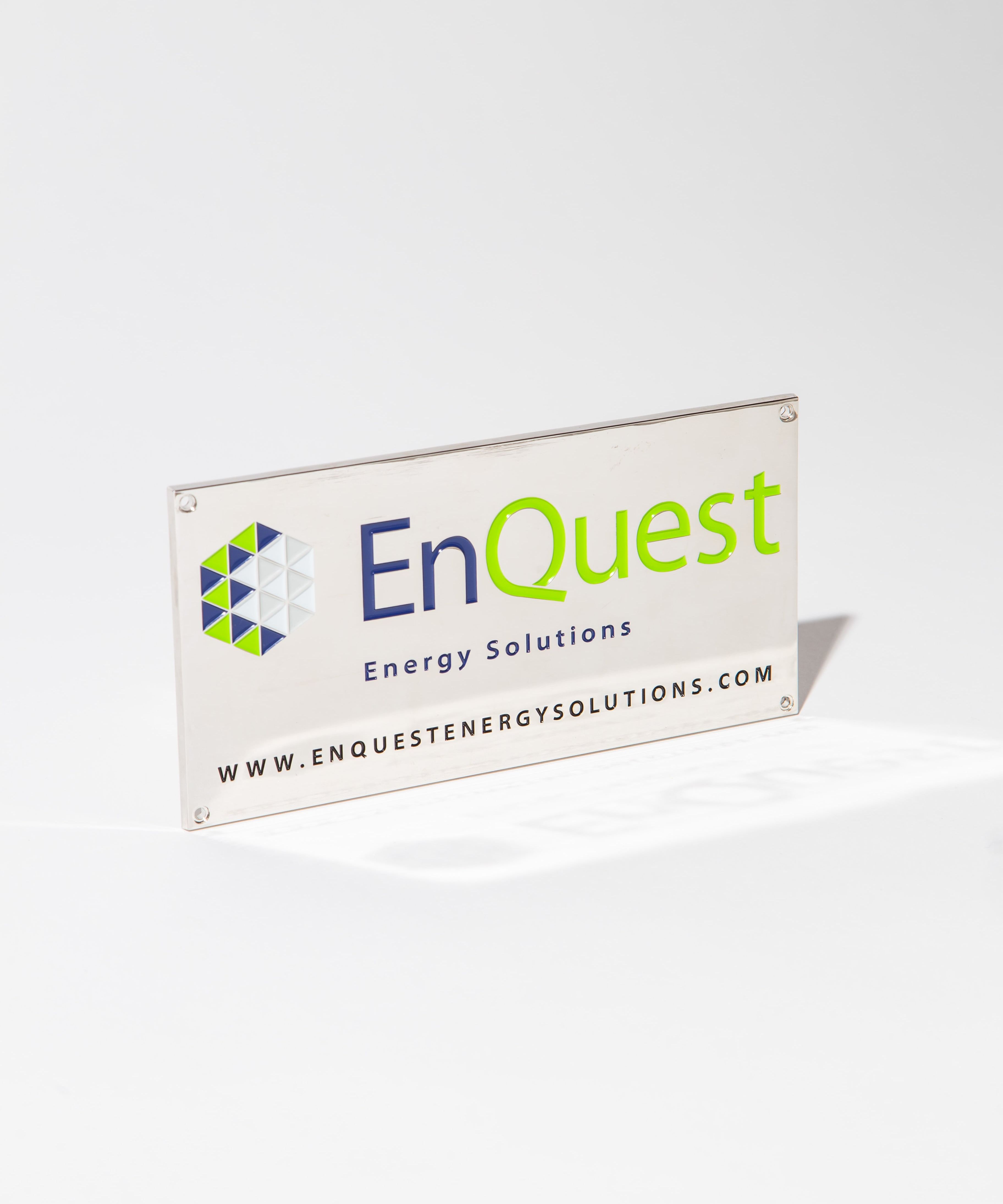 EnQuest Energy Solutions sign with logo and website URL on a white background.