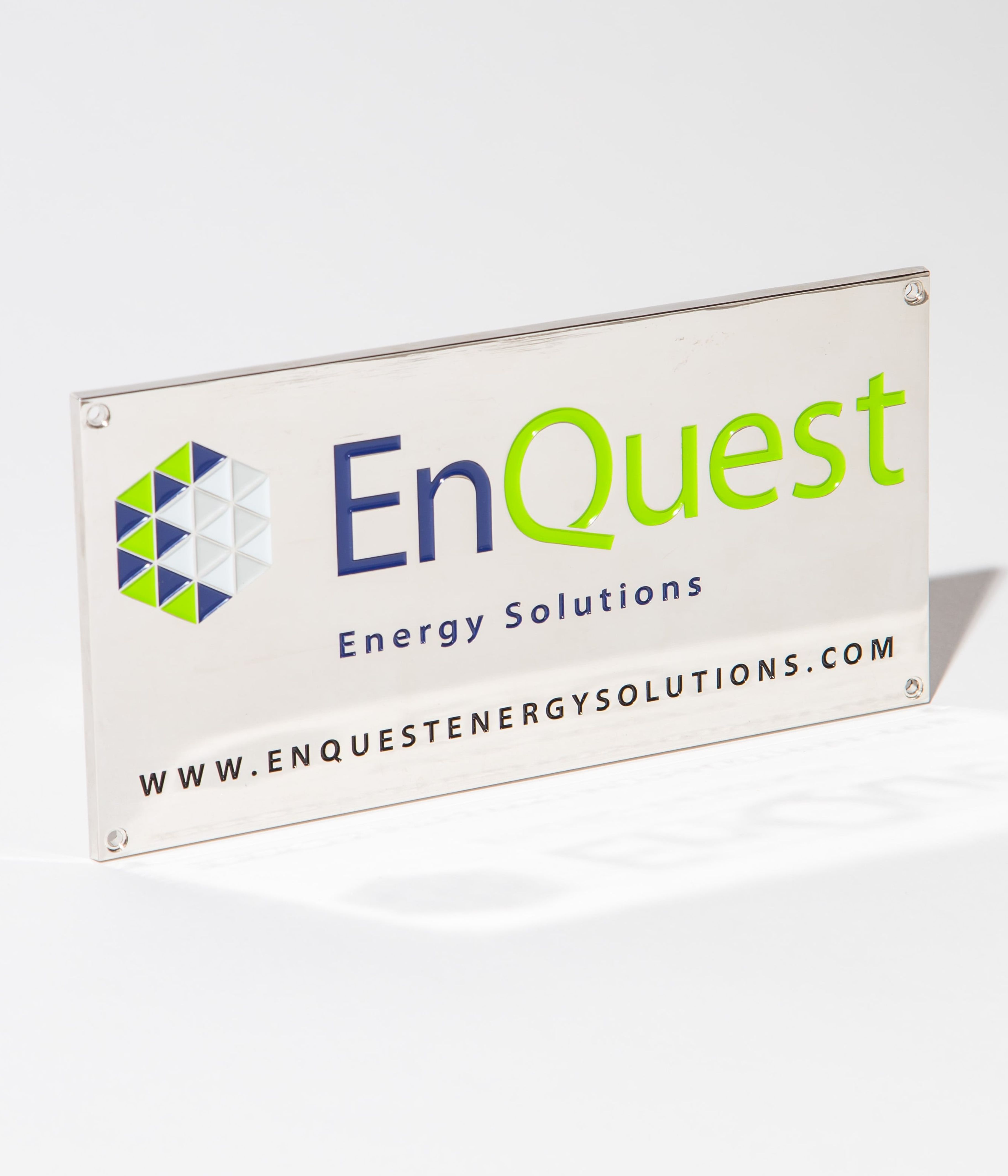 EnQuest Energy Solutions sign with logo and website URL on a white background.