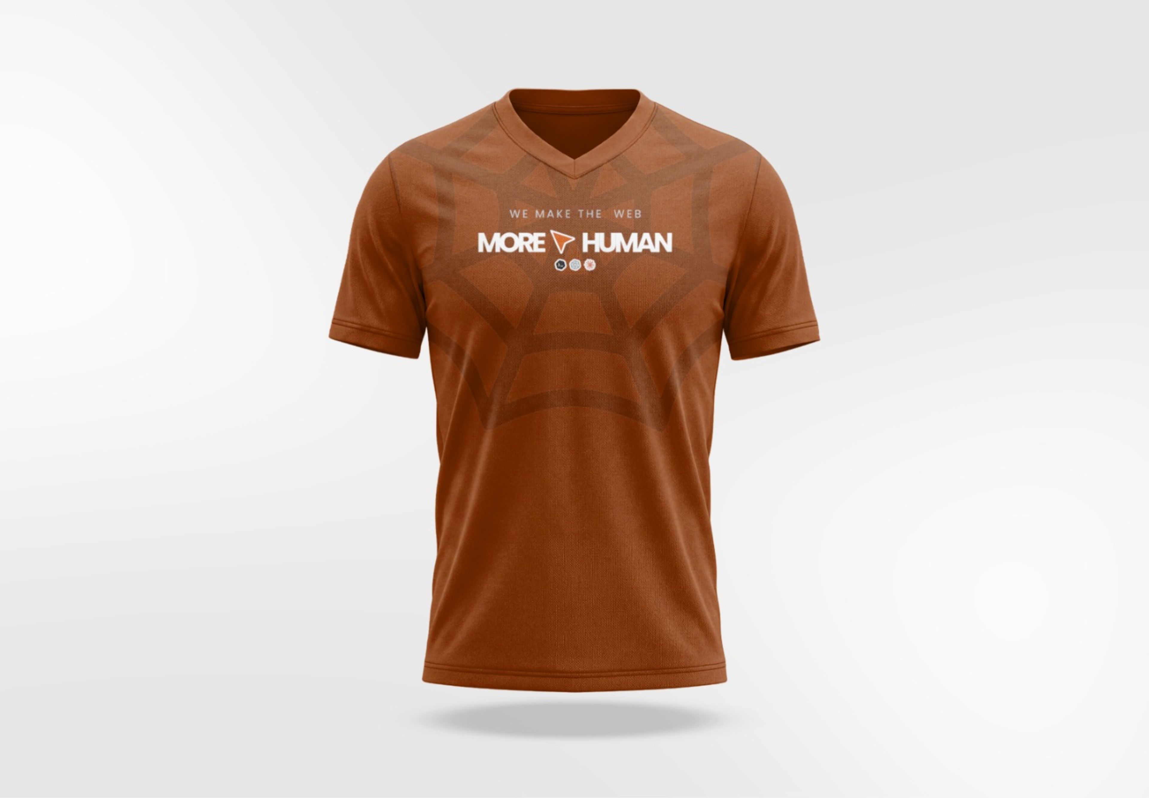 “We make the web more human” shirt in burnt orange, with a web pattern