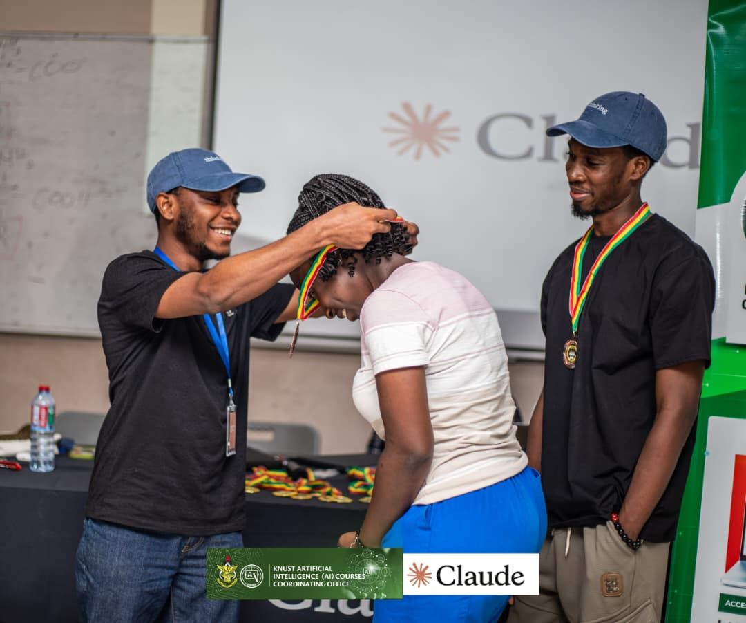 A medal being presented to a winner at the Claude Builder Club Hackathon, KNUST